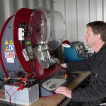 A mechanic expert diagnosing diesel engine components