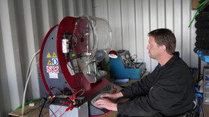 a mechanic using diesel diagnostic machine