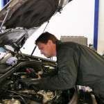 a mechanic fixing a diesel engine