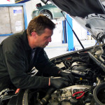 Mechanic fixing car problems